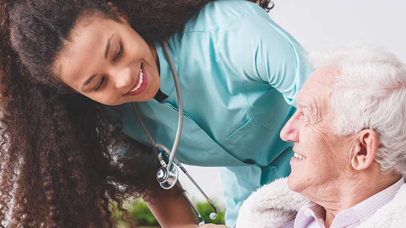 nurse and patient smiling